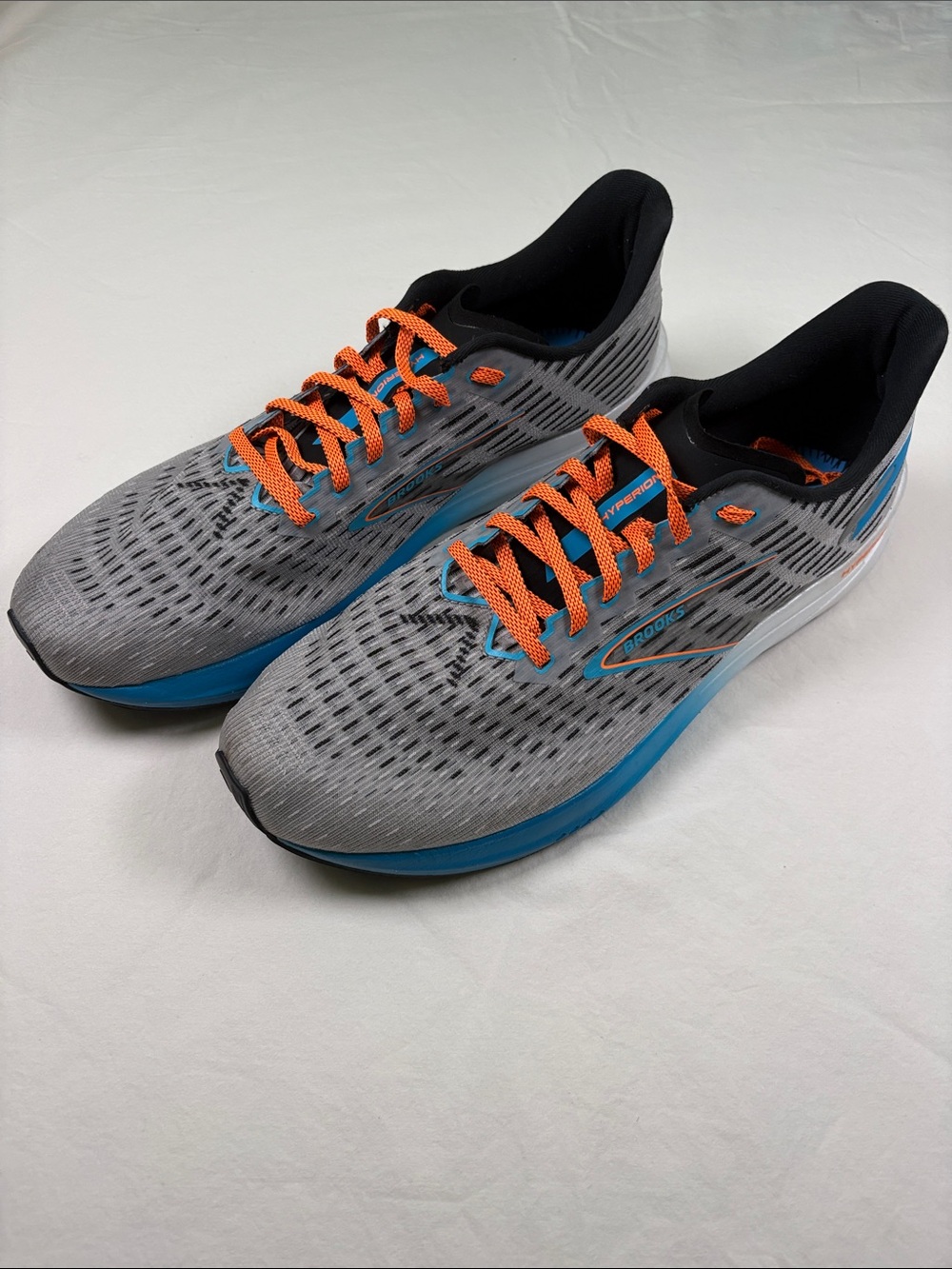 Brooks Gray Running Shoes with Blue Accents and Orange Laces